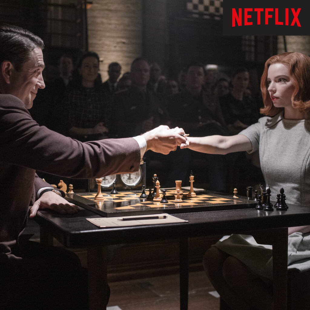 Beth Harmon and Vasily Borgov shake hands at the Moscow final of The Queen's Gambit, over Ferrer's Deluxe board